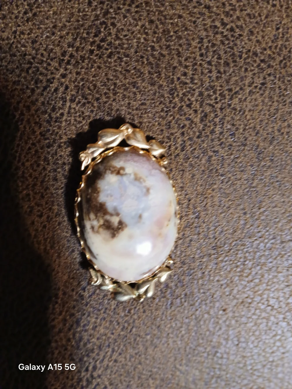 Gold-Tone Floral Frame Oval Cream and Brown Stone Brooch